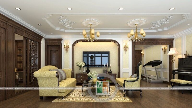Thiết kế nội thất chung cư Mandarin tân cổ điển cao cấp với tông màu vàng ánh kim chủ đạo trên nền sàn ốp gỗ màu nâu trầm làm nổi bật không gian căn phòng.